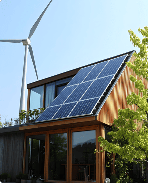 dom z panelami fotowoltaicznymi i turbiną wiatrową